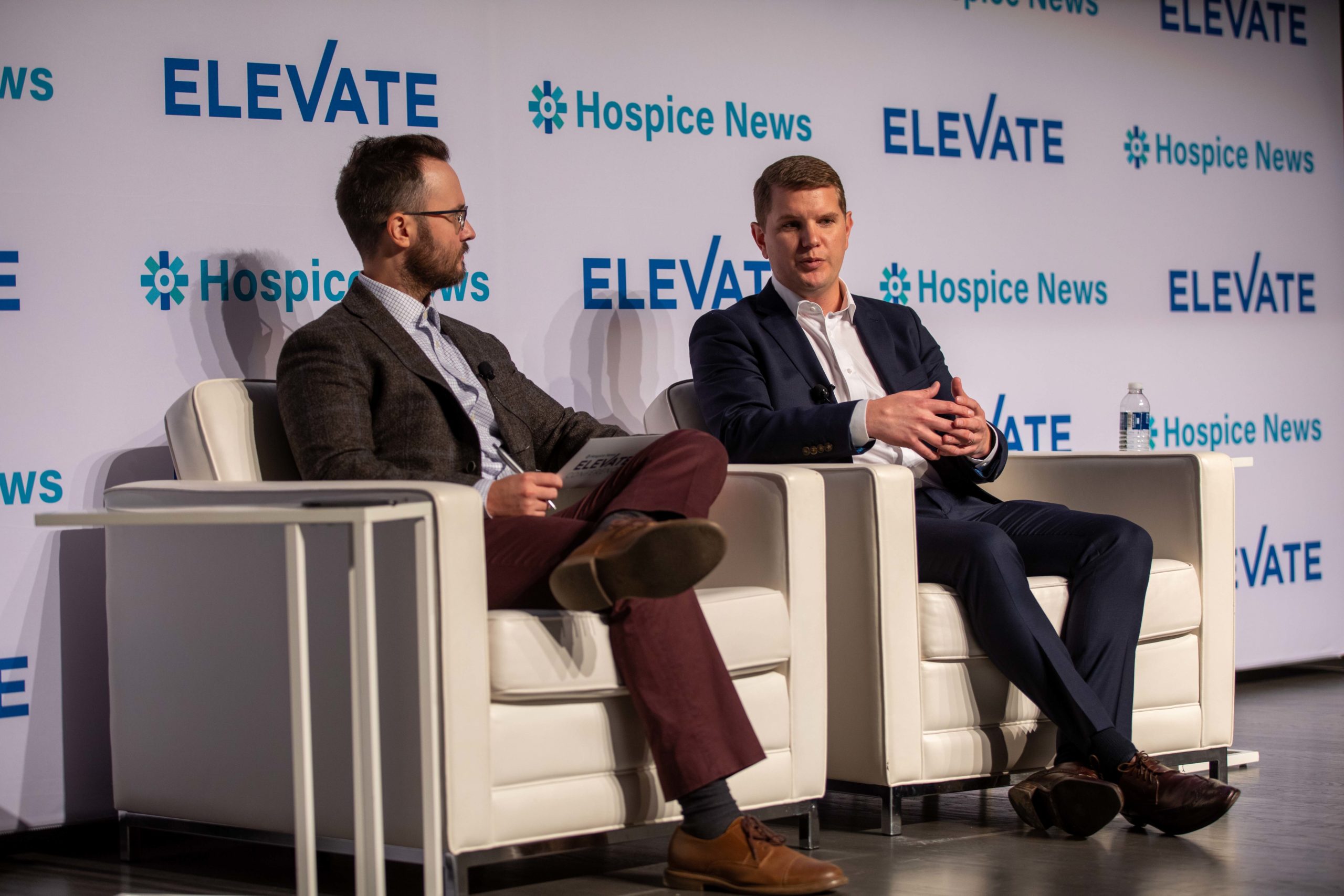 Photo of Daniel Reese, IntellaTriage CEO discussing patient experience at the ELEVATE conference with Bob Holly