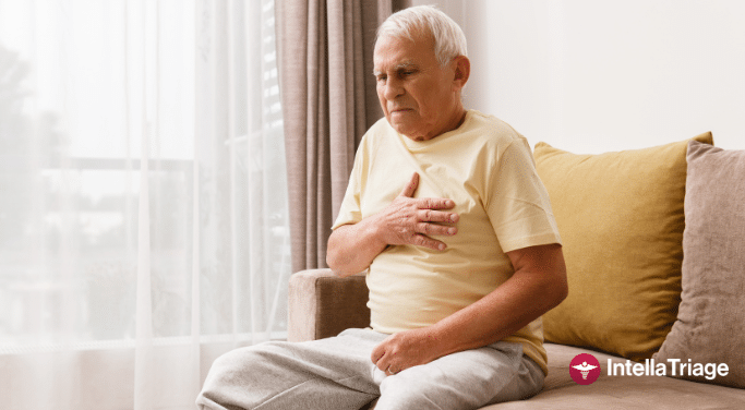 An elderly man sits on a couch, holding his chest in discomfort. He is wearing a yellow t-shirt and gray sweatpants, with a concerned expression on his face. The scene suggests a health issue, possibly related to heart or lung problems. The logo for IntellaTriage is visible in the bottom right corner.